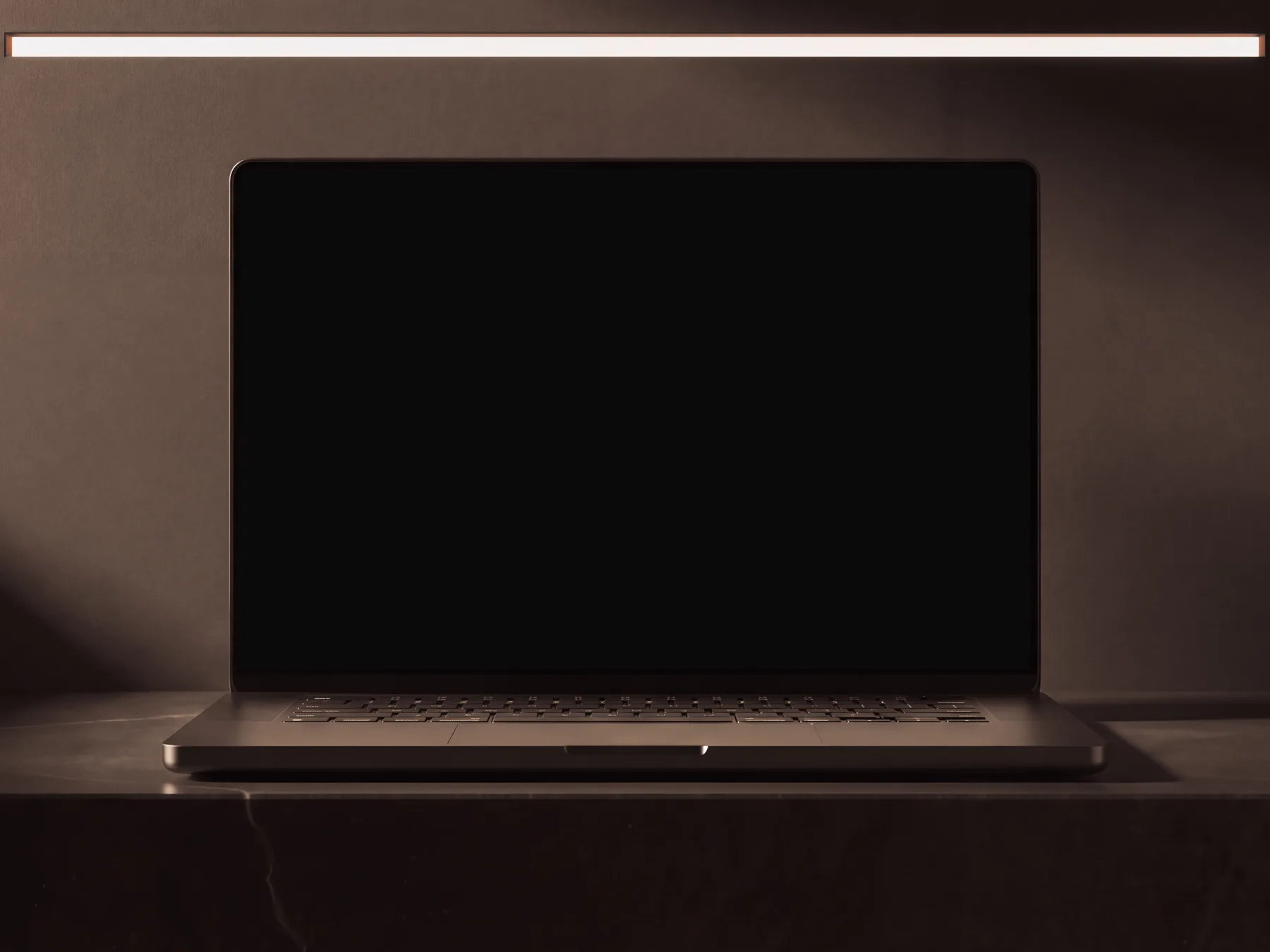 Laptop on a black basalt slab in a dark room